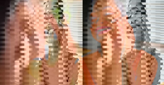 Woman applying suncreen