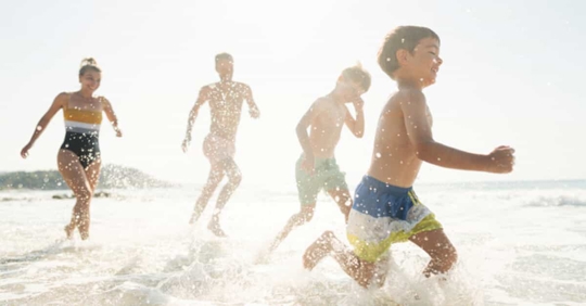 A family enjoying the summer at a beach